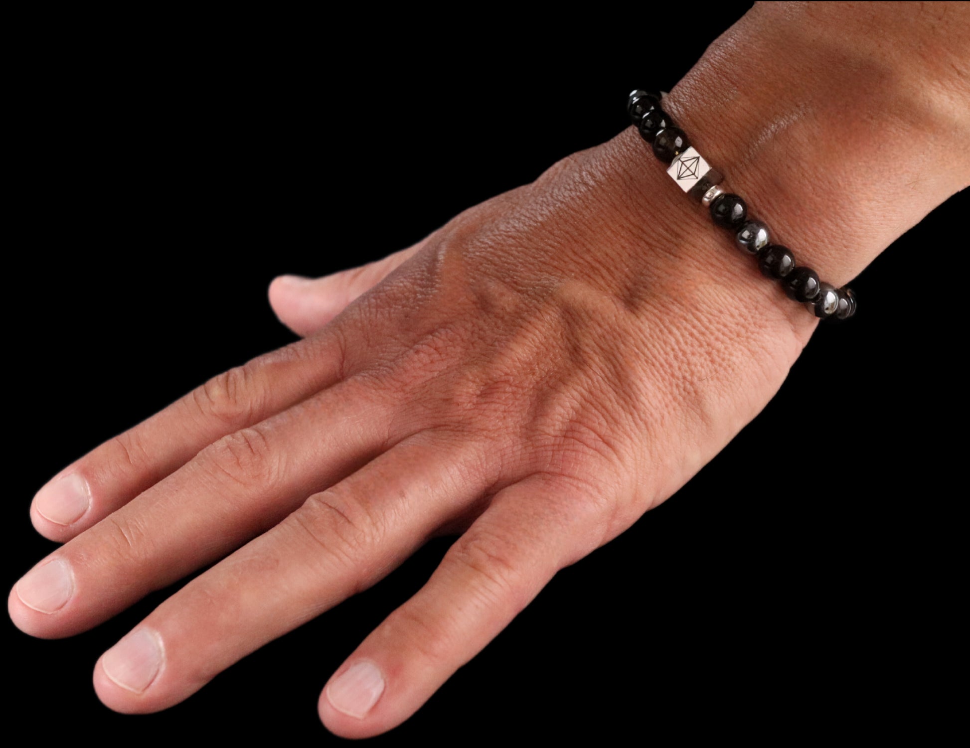 Black Onyx 8mm bracelet on open hand - elegant black gemstone silver jewelry lifestyle