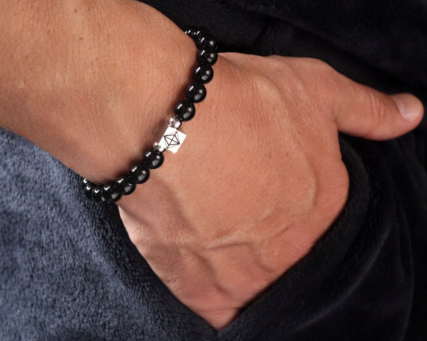 Black Onyx 8mm bracelet worn wrist lifestyle - timeless black gemstone jewelry men