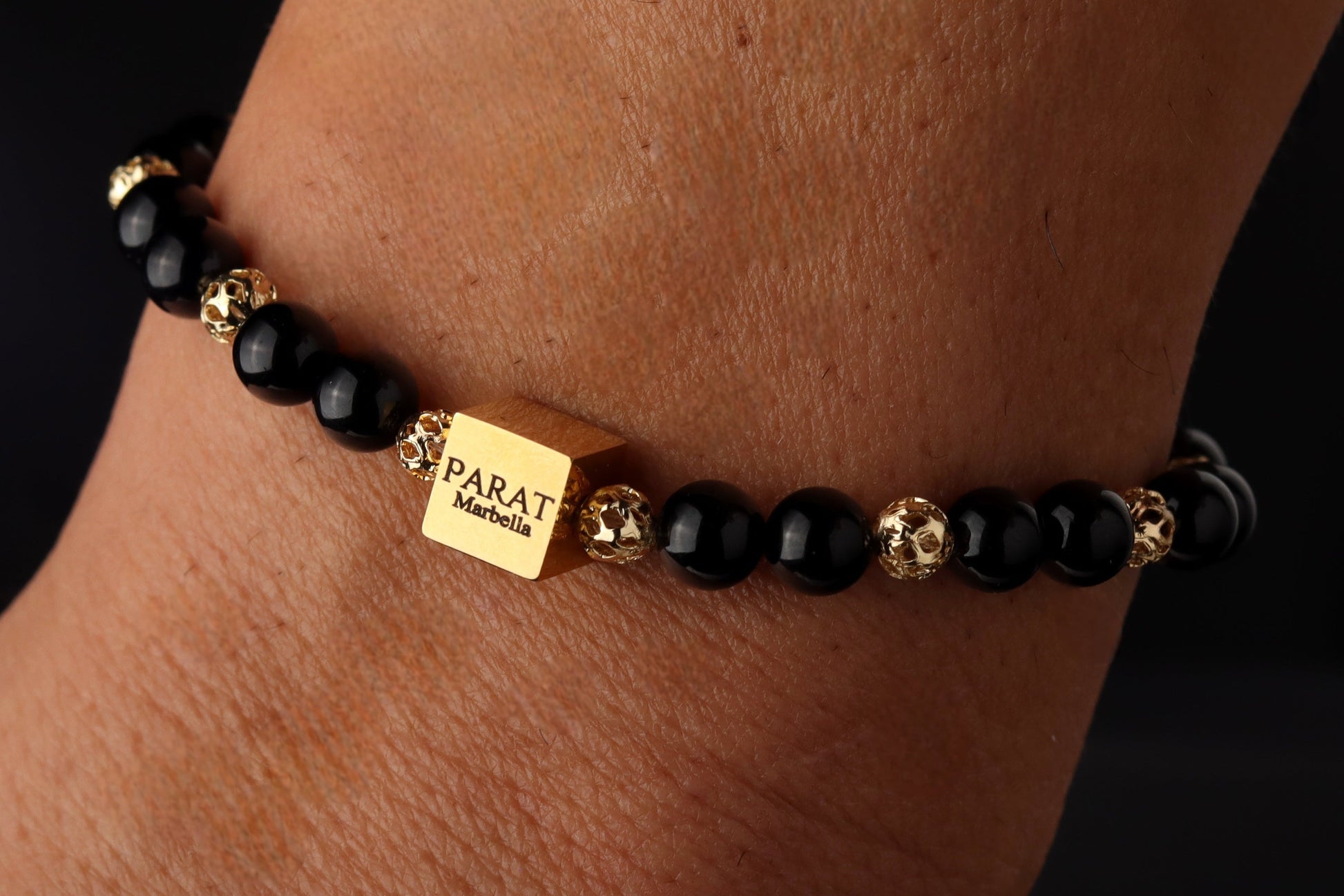 Black Tourmaline 6mm bracelet with 14K gold beads worn on wrist - men's protection jewelry lifestyle PARAT Marbella