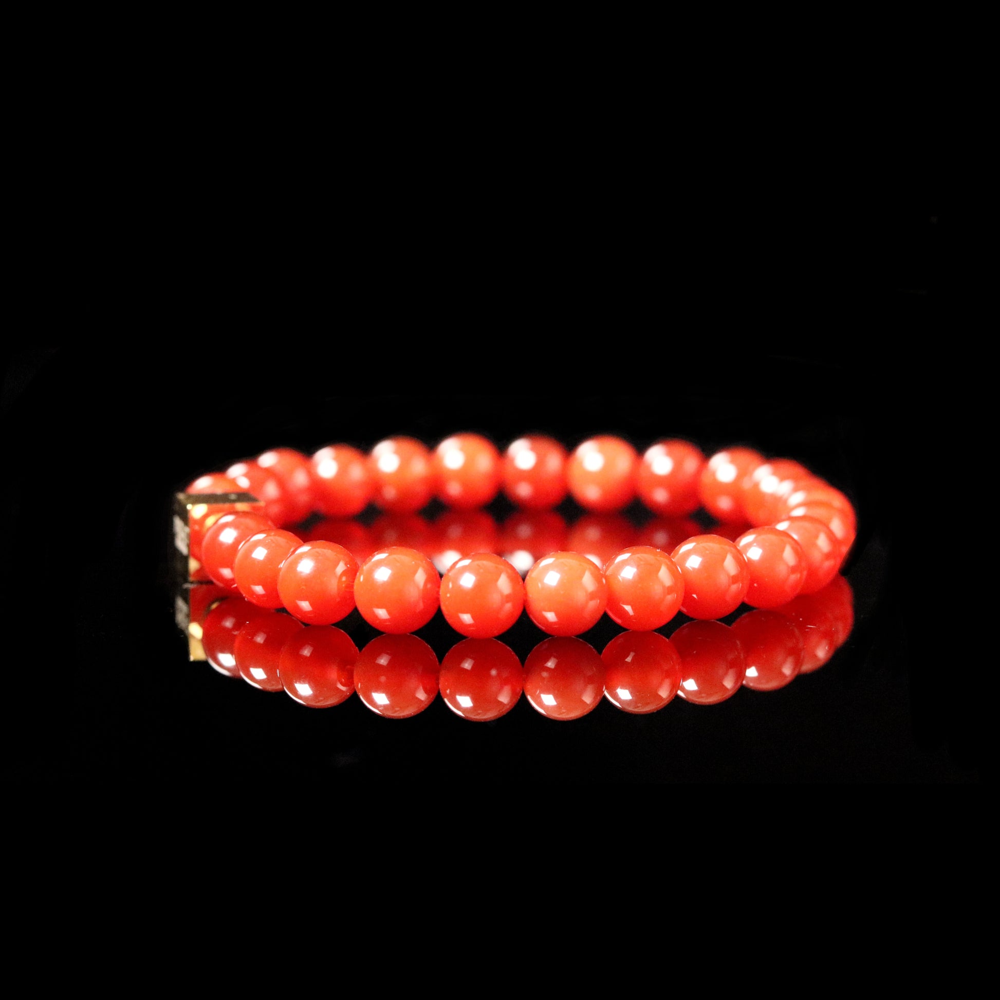 Carnelian vibrant fire orange bracelet reflection - warrior stone luxury jewelry