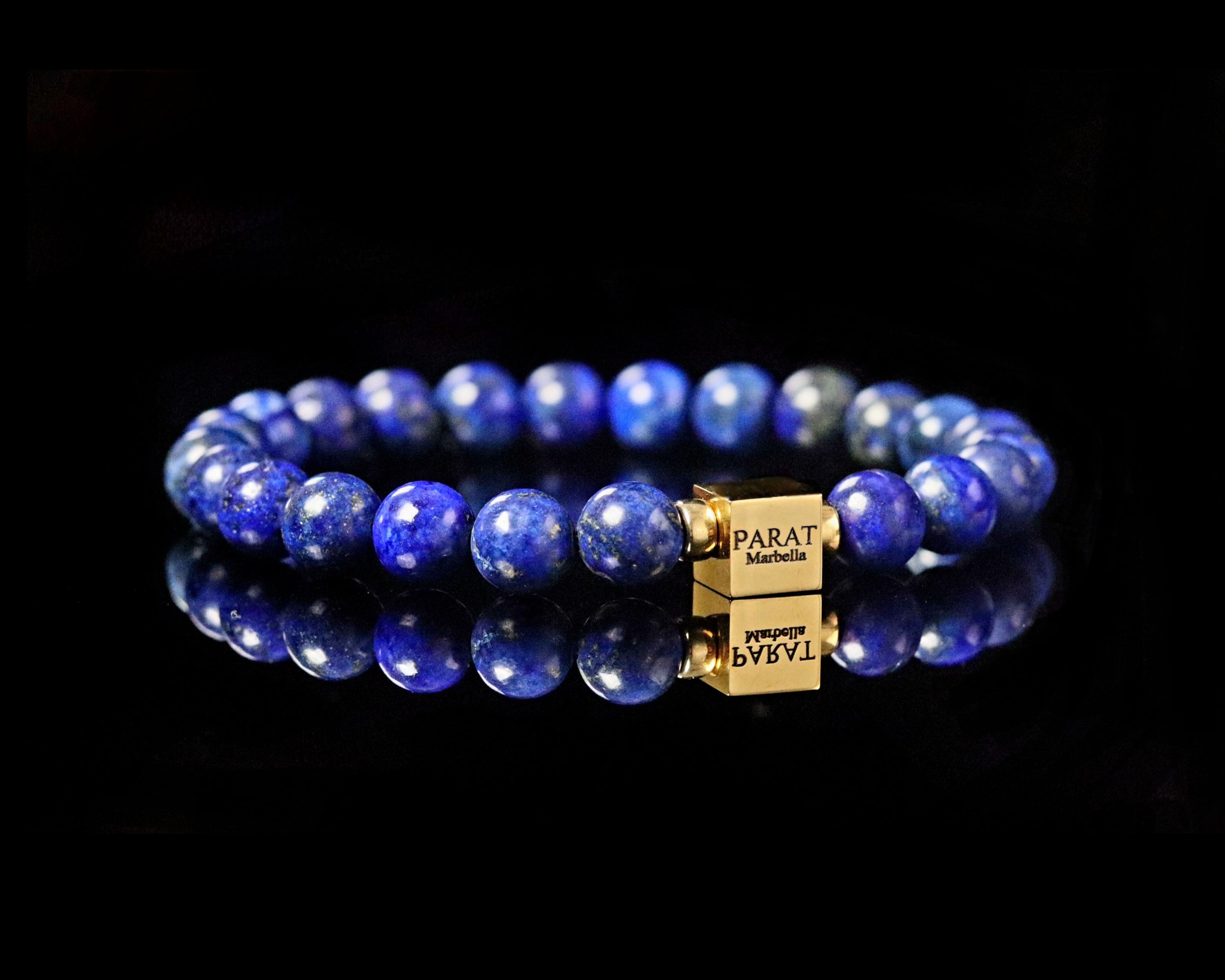 Blue Lapis Lazuli beaded gemstone men bracelet with a gold clasp Parat Marbella on a black background