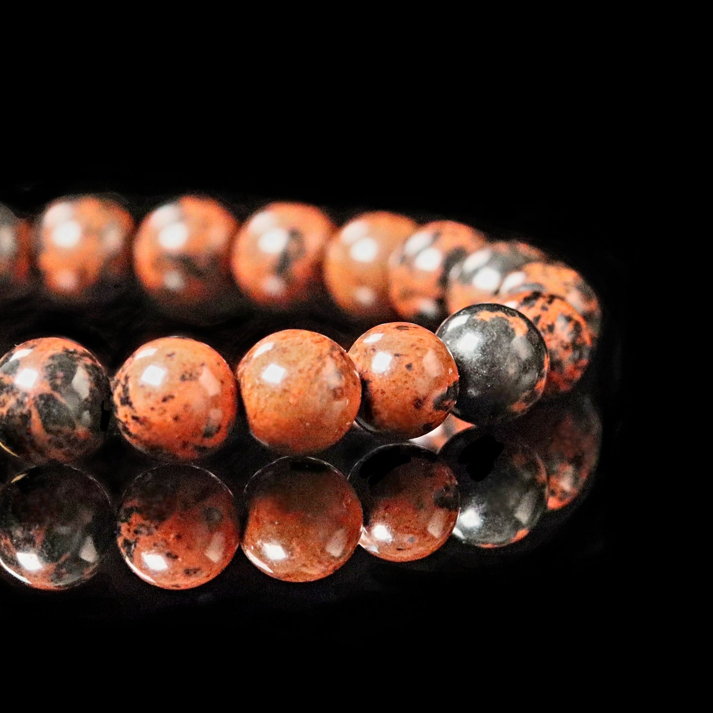 Close-up Mahogany Obsidian stones - natural brown red black patterns 8mm beads