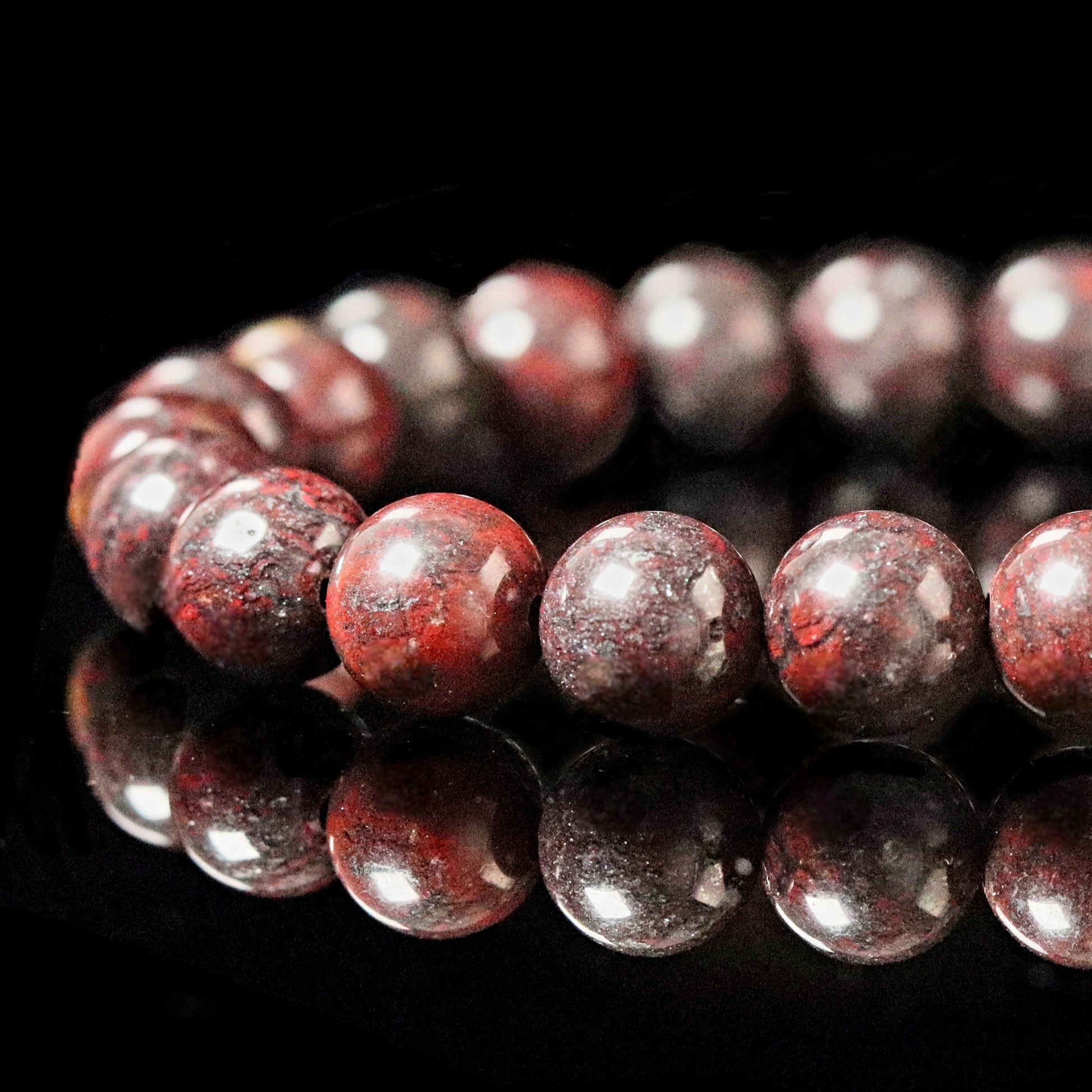 Unique Almandine Garnet burgundy red with dark blue spots - rare color-play gemstone- close up
